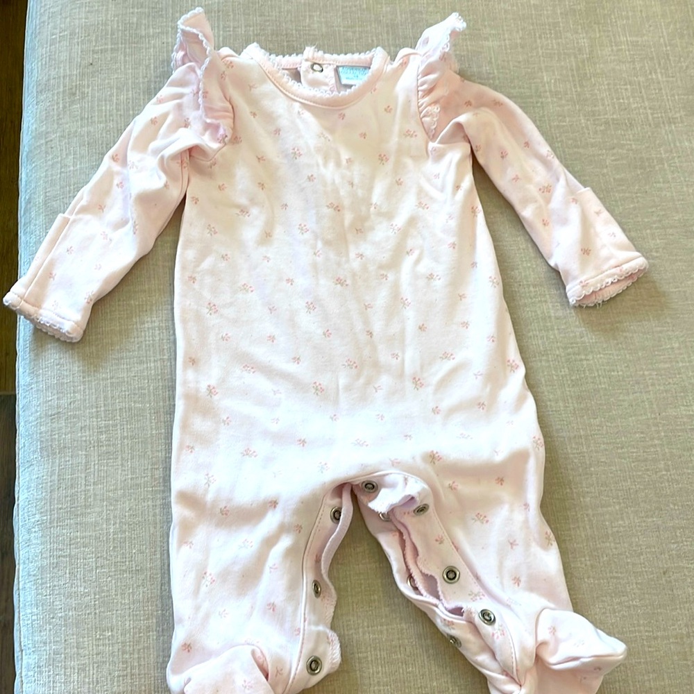 Pink onsie with ruffle shoulders